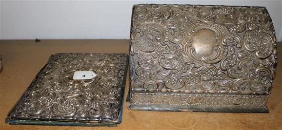 Silver-mounted blotter, London 1903, Wm Comyns and a similar foliate decorated domed leather-covered stationery box